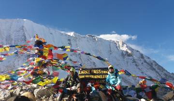 Group of people at Larke Pass with prayer flags.