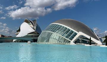 Futuristic architecture with glass and water reflections.