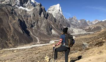 Hiker looking at a rugged mountain landscape.