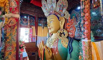 Ornate statue in a colorful temple interior.