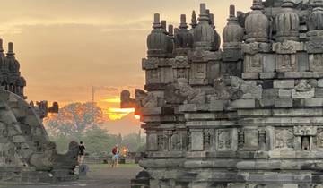 Sunset view of an ancient temple with intricate carvings.