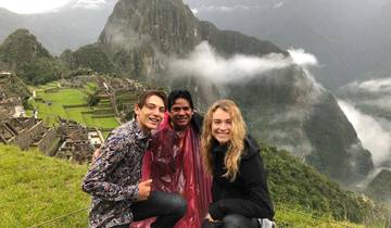 Group of three people at Machu Picchu.