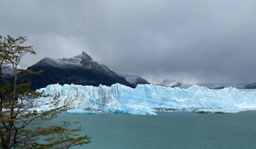 Glacial landscape with ice formations and mountains.