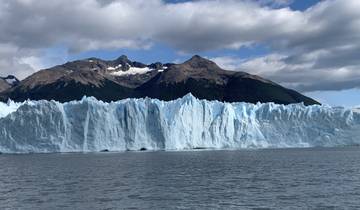 Glacier with mountain backdrop.