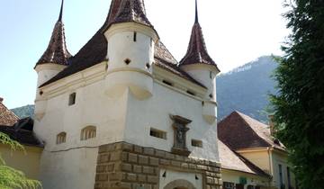 Historic building with pointed towers and decorative architecture.