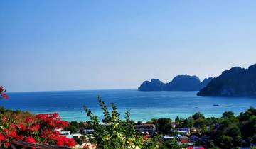 Scenic view of a bay with vibrant water and rocky islands.