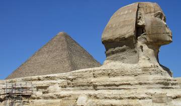 The Great Sphinx and Pyramid of Giza under a clear blue sky.