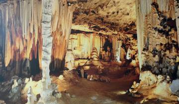 Beautiful cave interior with dramatic stalactites and rock formations.