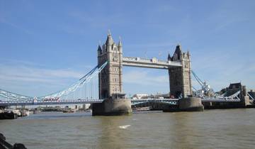 Tower Bridge over the Thames with a clear blue sky.