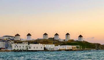 Windmills on a hill near the sea in Mykonos.
