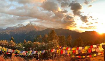 Sunset view of Annapurna mountain range with prayer flags in the foreground