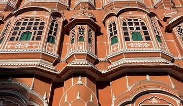 Facade of a pink historical building with many windows.