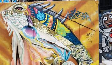 Colorful graffiti mural featuring an iguana and astronaut.