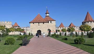 Fortress with red rooftops and wide pathways.