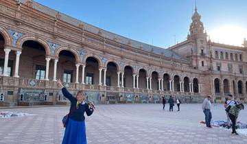 Person posing in front of a historical building