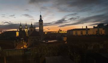 Skyline with historic buildings against a sunset.