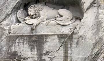 Lion monument carved into a rock.
