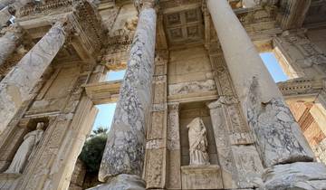 Ancient ruins with detailed carvings and columns.