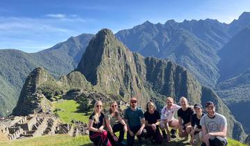 Group posing in front of the Machu Picchu ruins.