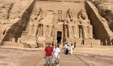 Tourists in front of the Abu Simbel temples with large statues.