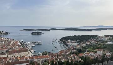 Aerial view of a coastal harbor with boats.
