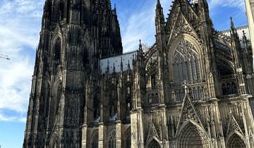 Gothic cathedral with intricate details and a clear sky.