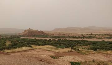 Desert landscape with ancient structures.