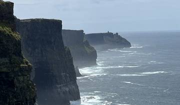 Cliffs on a misty day overlooking the ocean.