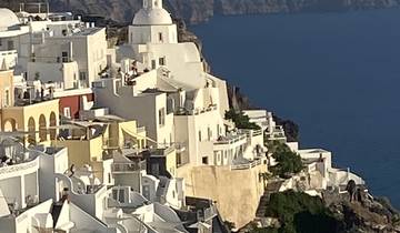 View of white buildings along the coastline.
