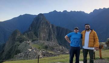 Two people posing in front of Machu Picchu.