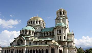 Beautiful cathedral with a green dome and intricate architecture.