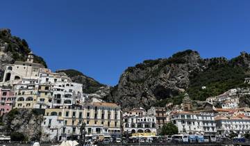 Coastal town with colorful buildings built on a cliffside.