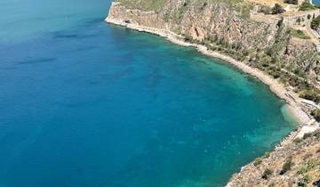 Beautiful aerial view of a shoreline with clear blue waters.