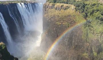 Stunning view of Victoria Falls with a rainbow.