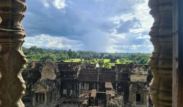 View through a temple opening overlooking ancient ruins.
