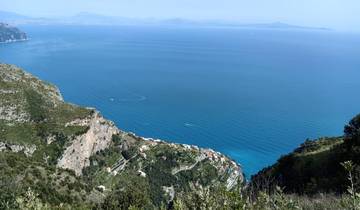 A stunning view of the coastline and blue sea from above.