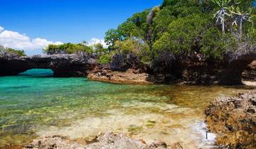 Rocky shore with clear turquoise water.