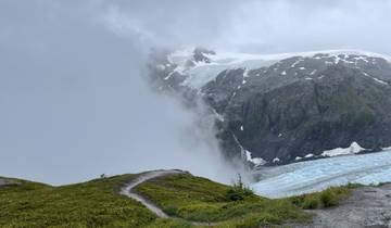 Foggy mountain landscape with a glacier.