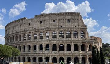 Iconic Colosseum with a clear blue sky.