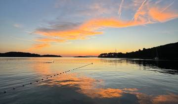 Stunning sunset over the sea with reflection.