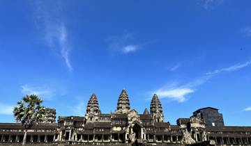 Angkor Wat temple complex under a clear blue sky.