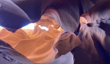 Beautifully lit canyon with smooth rock formations.