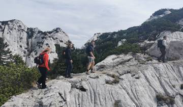 Hikers on a rocky mountain trail.