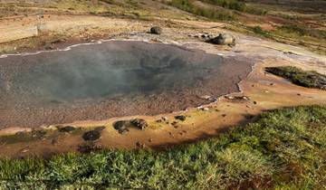 Geothermal hot spring with colorful mineral deposits.
