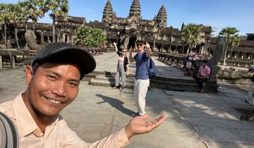 Tourists in front of Angkor Wat temple.