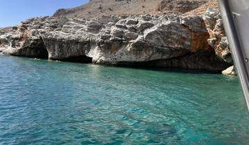Scenic view of rocky cliffs and blue water.