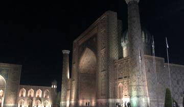 Night view of an ornate building with domes