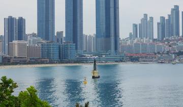 View of a coastal city with high-rise buildings by the water.