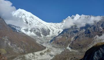 Majestic snow-capped mountain peaks under a clear sky.