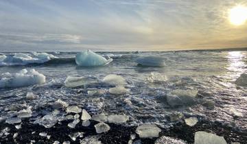 Icebergs floating in a serene glacial lagoon.